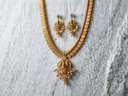 Antique Gold Plated Goddess Lakshmi Kasu Mala Long Haram Necklace Set with Matching Jhumkas